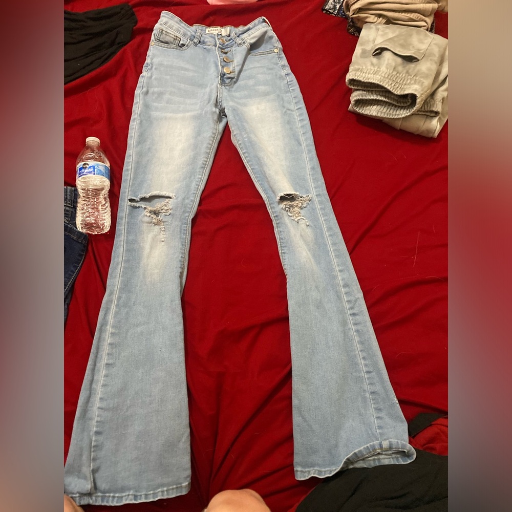 ripped light blue bell bottoms